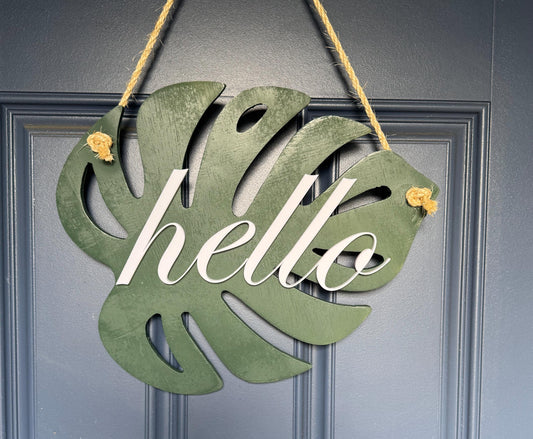 Back view of monstera leaf door hanger showing twine hanger