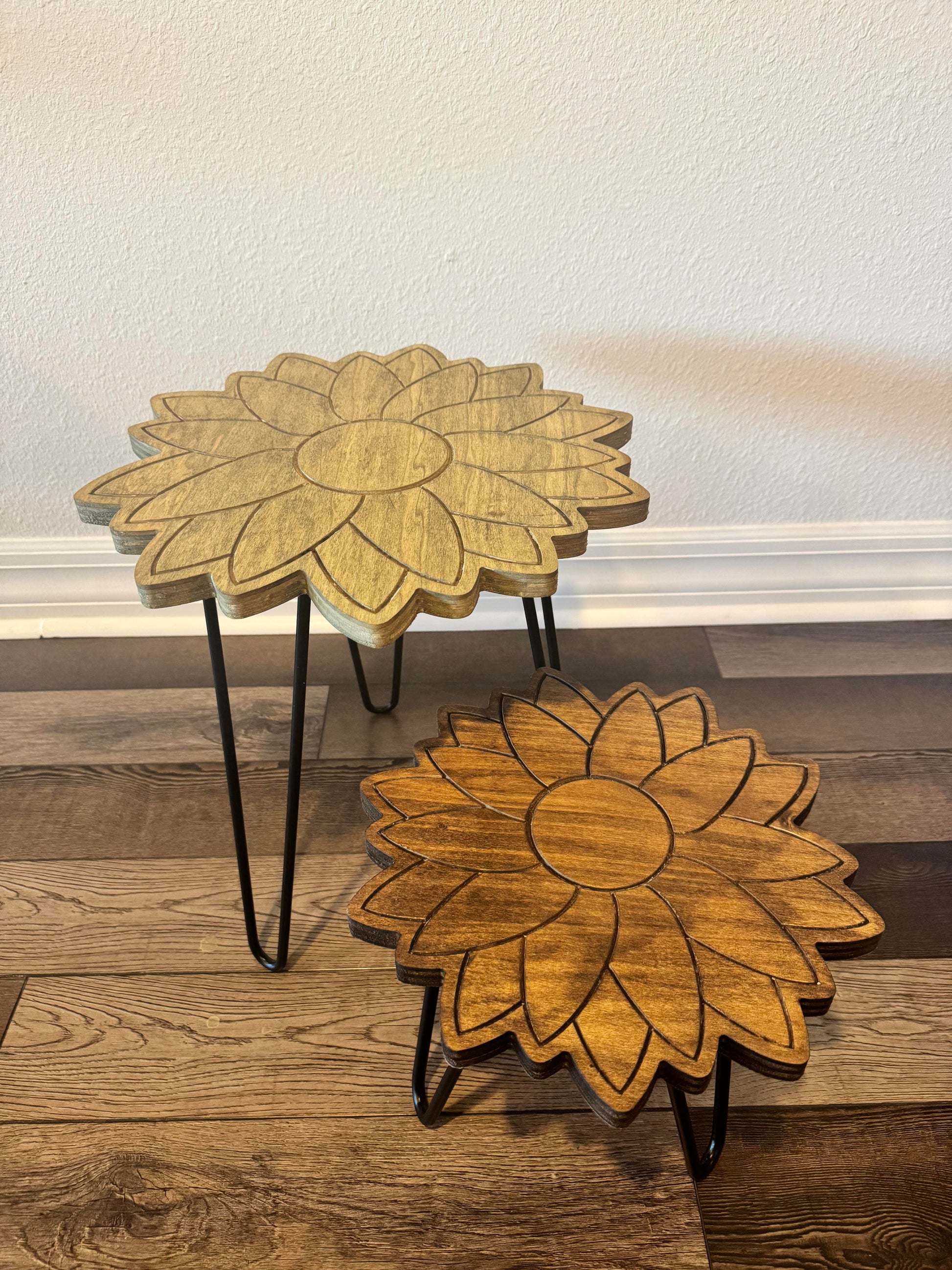 Angled view of the engraved sunflower plant stand and metal legs