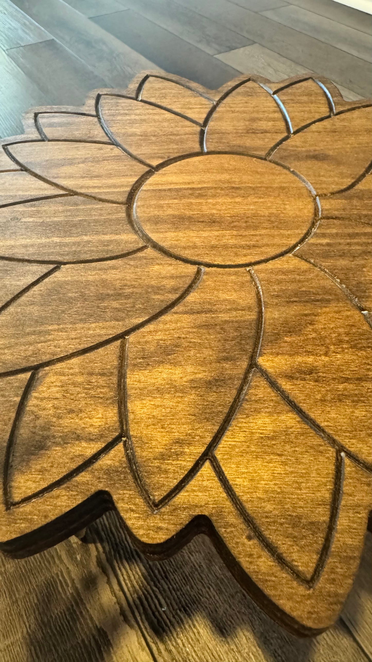Detailed top view of the engraved wooden sunflower design