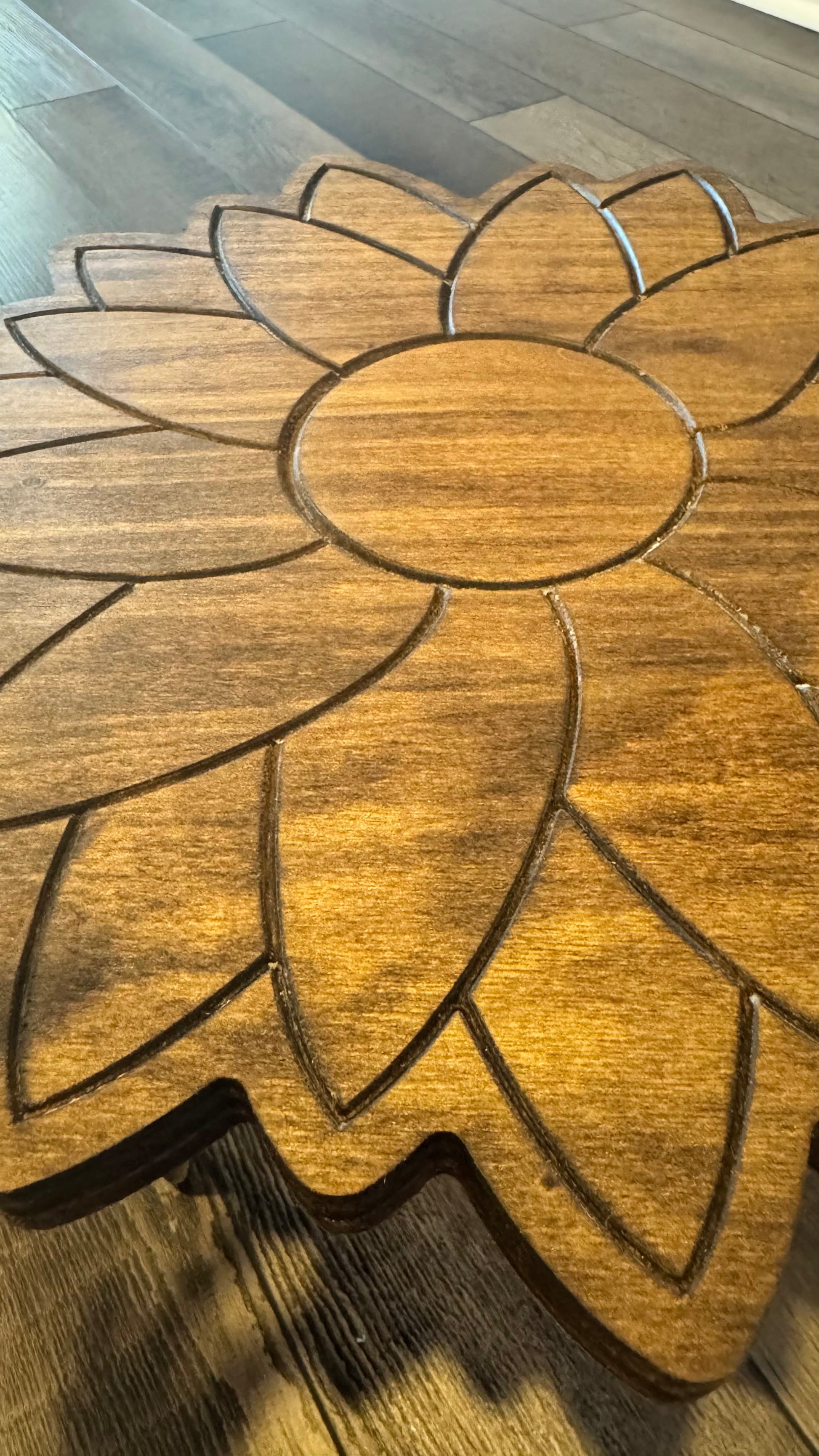 Detailed top view of the engraved wooden sunflower design