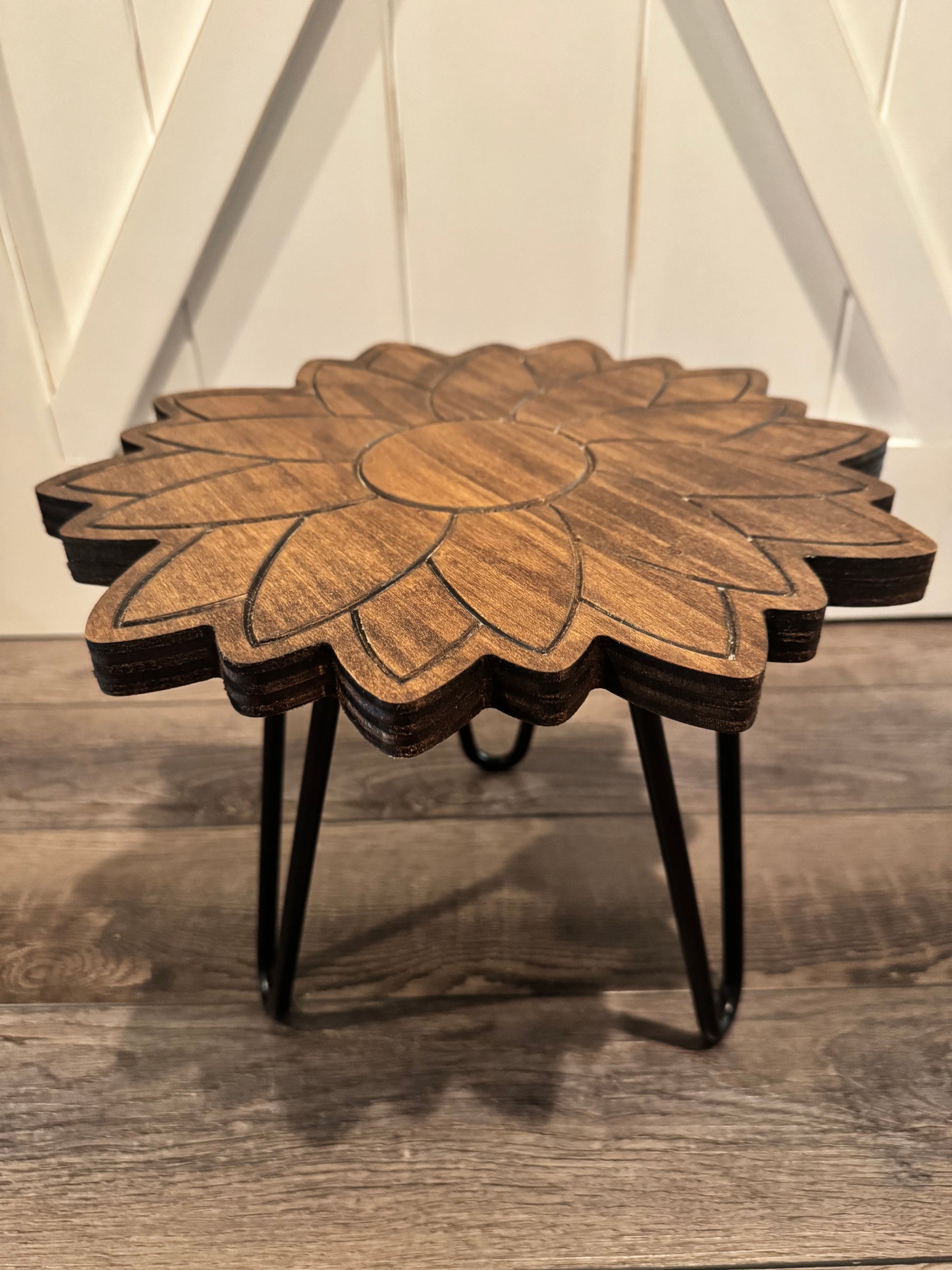Close-up view of the sunflower plant stand's engraved petal surface